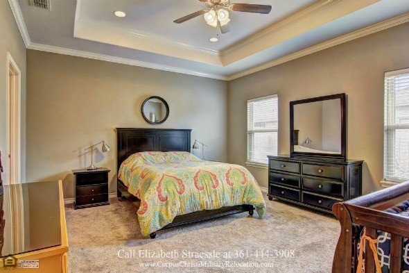 Homes in Corpus Christi TX - Rest and relaxation comes easy in this Corpus Christi home’s stunning master bedroom. 