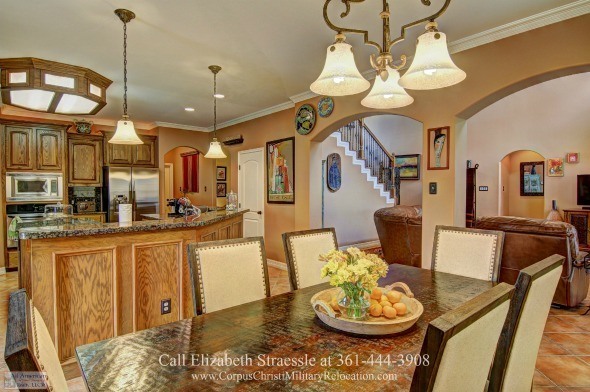Homes in Corpus Christi TX - Enjoy the company of friends in the elegant dining space of this home for sale in Corpus Christi.