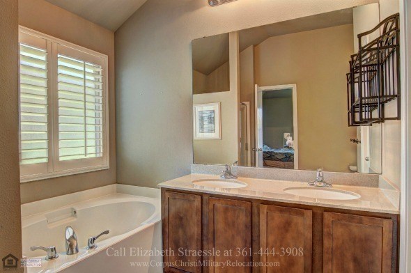 Portland TX Homes - End your day with a relaxing soak in the lovely master bathroom of this Portland TX home. 